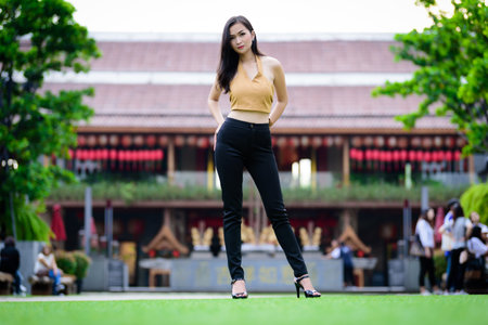 Asian pretty and sexy portrait girl has relaxing at garden in the morning.の写真素材