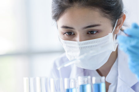 Asian young girl student scientist researching  and learning in a laboratory.の写真素材