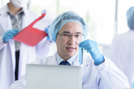 Asian senior scientist male researching and learning in a laboratory.の写真素材