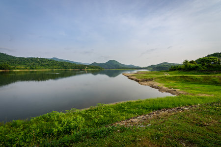 The landscape of nature with mountain, river, forest and clouds in the morning.