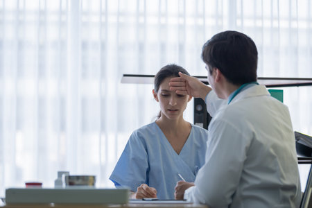 A doctor take care of sick patient woman at the hospital or medical clinic.の写真素材