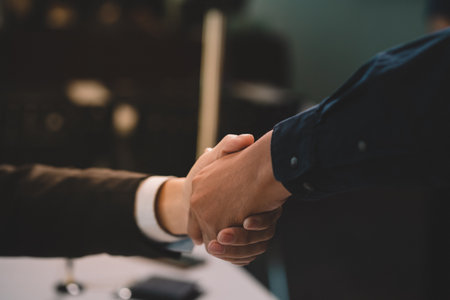 Businessman making agreement at office. it's a contract paper. Human hand holding pen mystery document on the table. It's a big decisions for business corporate.の写真素材