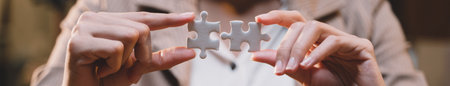 Banner background of business hands connecting jigsaw puzzle, success and goal achievement, the last jigsaw is the link of all the pieces. strategic planning or a solution for the management.の写真素材