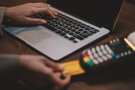 Customer using credit card for payment to owner business. cashless technology and credit card payment concept. through the internet for convenience.の写真素材