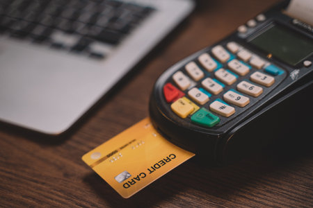 Customer using credit card for payment to owner business. cashless technology and credit card payment concept. through the internet for convenience.の写真素材