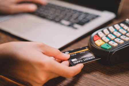 Customer using credit card for payment to owner business. cashless technology and credit card payment concept. through the internet for convenience.の写真素材