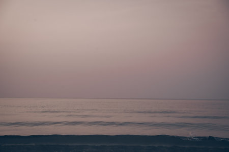 the wave in the beach before sunrise and the vanilla clearly sky, the landscape photo of the beautiful lonely beach on the dawn with no people and cloud.の写真素材