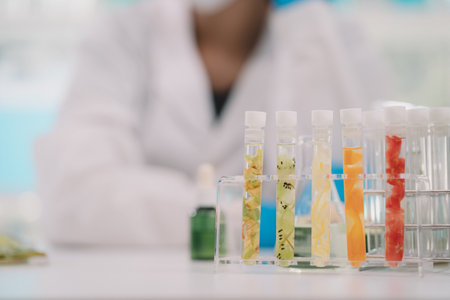 Cosmetic laboratory research and development , lab glassware containing fresh fruits.の写真素材