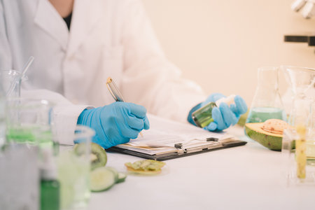 Researchers are documenting the results of beauty product research in cosmetic lab.の写真素材