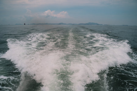 In the warmth of summer, a boat drifted across the sea, riding each ocean wave with ease, where...