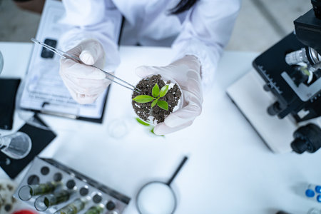 In the green laboratory, biology and technology intersect as researchers conduct experiments on...