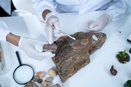 In the laboratory, research equipment rests on the table as scientists analyze rock samples, using advanced geology techniques to make groundbreaking discoveries in science.の写真素材