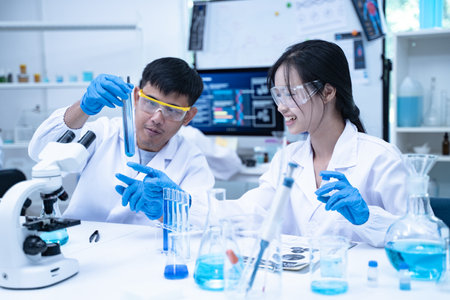 In the laboratory, several researchers and scientists, each focused on their own biology experiments, conduct detailed analysis to advance the field of science and deepen understanding.の写真素材