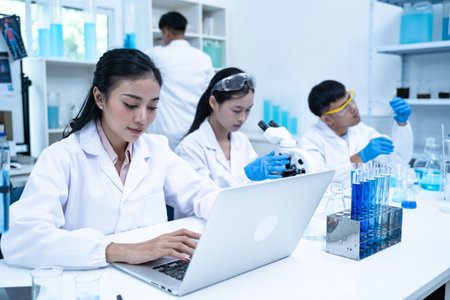 In the laboratory, several researchers and scientists, each focused on their own biology...