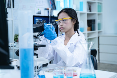 In the laboratory, several researchers and scientists, each focused on their own biology...