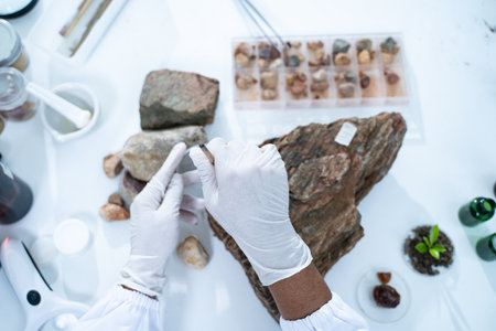 In the laboratory, research equipment rests on the table as scientists analyze rock samples, using advanced geology techniques to make groundbreaking discoveries in science.の写真素材