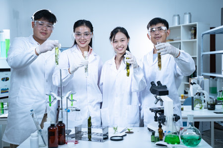 In the laboratory, researchers celebrate their success in geology and biology, examining samples and using analysis to make groundbreaking discoveries in education and exploration.の写真素材