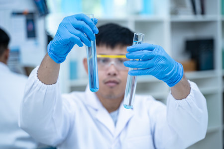 In the laboratory, several researchers and scientists, each focused on their own biology...