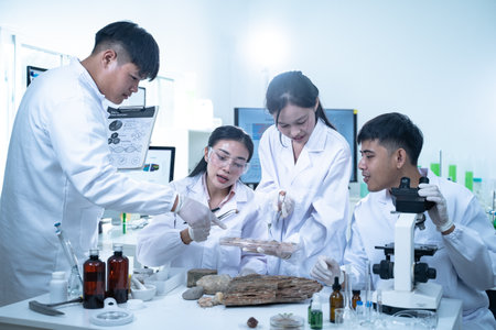 In the laboratory, scientists conduct experiments on geological samples, using analysis and research to study the Earth's composition and deepen our understanding of geological science.の写真素材
