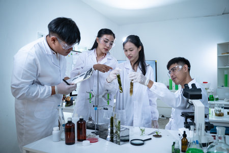 In the green laboratory, scientists work independently, conducting research in biology and medical...