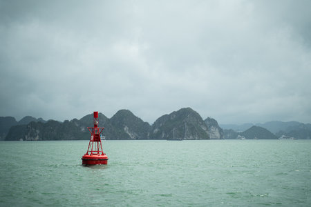 A buoy floats on the ocean, sending a maritime warning to ensure safety at sea, guiding navigation through the water for every vessel in the vast marine world.の写真素材