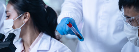 Laboratory research with blood sample in test tube for medical analysis related to health and...