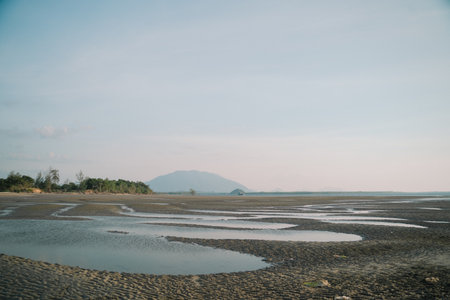 In summer, we travel to the beach where the ocean meets the sea, water sparkles under the sun, and natureâs beauty turns every vacation into a perfect escape.の写真素材