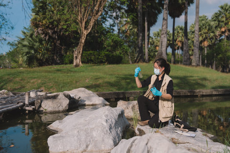 In nature and the environment, science teams conduct field research, collect each water sample,...