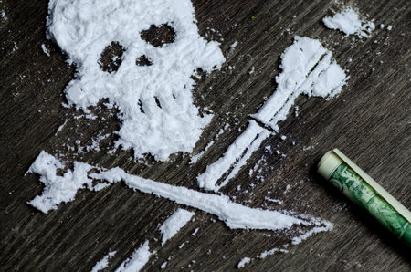 Drug powder cocaine in the silhouette of the skullの写真素材