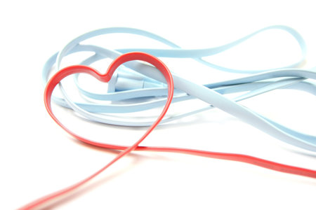 Red Heart Shaped Network Cable on white backgroundの写真素材