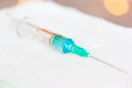 Syringe on a white cloth.