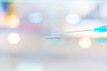  Syringe laying on the ground glass.の写真素材