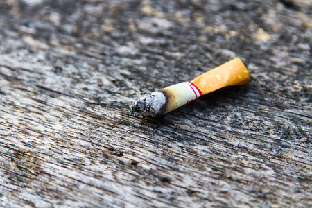 Cigarette smokers are already on a wooden table.の写真素材