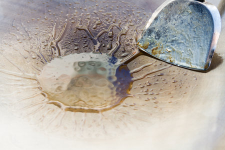 Frying pan with oilの写真素材