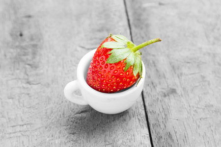 Strawberry with red, but black and white and color performance.の写真素材