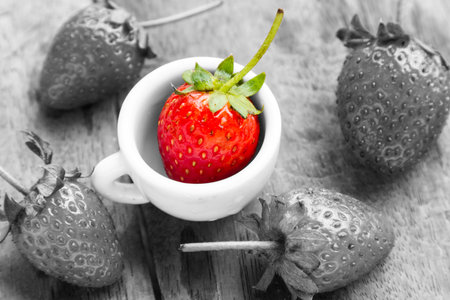 Strawberry with red, but black and white and color performance.の写真素材