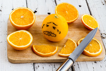 Was sliced oranges and orange with black writing like symptoms regret.の写真素材