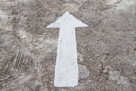 The arrows on the cement floor.の写真素材