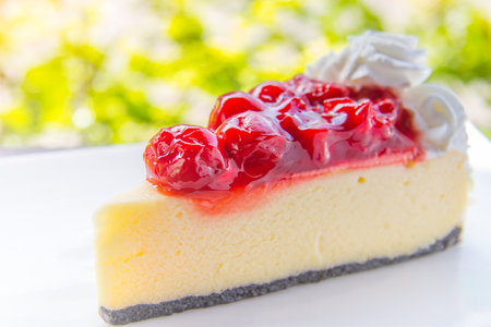 White cake and eat cherry red.の写真素材