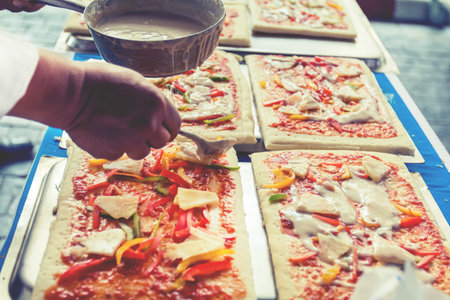 Pizza is an Italian restaurant that is popular around the world cooked by chefs who are capable of doing the dishes cooked with tomato sauce and a variety of vegetables and herbs.の写真素材