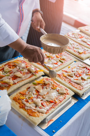 Pizza is an Italian restaurant that is popular around the world cooked by chefs who are capable of doing the dishes cooked with tomato sauce and a variety of vegetables and herbs.の写真素材