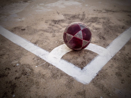 Old ball on concrete floorの素材