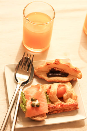 Bread with chocolate , Sausage , Smoked Salmon and orange juiceの写真素材