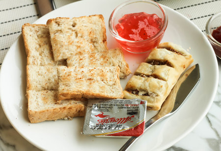 Bread toasts for breakfast with strawberry jamの写真素材