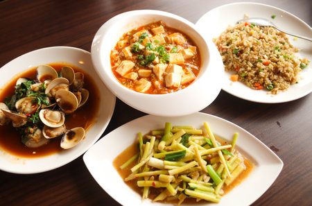 Four chinese food,Yangzhou fried rice ,Stir fried Bamboo shoots,Mapo doufu,Fried clams with basilの写真素材