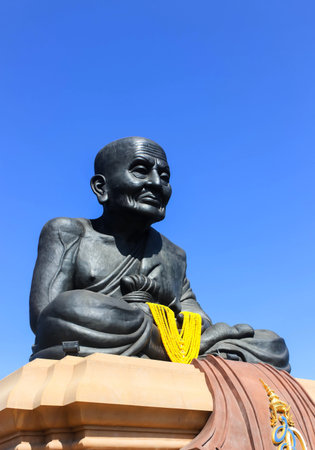 Luang Phor Tuad Statue at Wat Huai Mongkhon with Blue Skyの写真素材