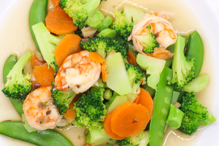 Thai food stir fried broccoli with shrimp on white plateの写真素材