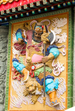 colorful low relief of god warrior in Sik Sik Yuen Wong Tai Sin Temple,Hongkongの写真素材