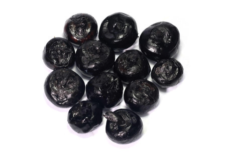 Closeup of fresh black water chestnut on white backgroundの写真素材