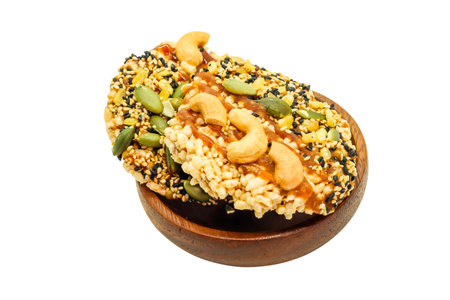 Close up of two Sweet Crispy Rice Cracker with several cereal on wood cupの写真素材